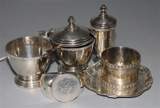 A silver three-piece condiment set, two silver napkin rings and a pin tray.